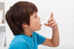 Boy using Inhaler