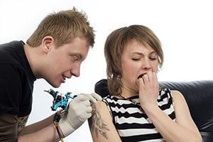 Woman getting a Tattoo