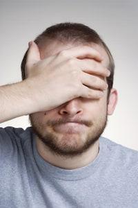Man with Hand on Face